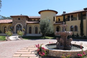 Half Round Copper Gutter, cast bronze scroll straps, copper finials, radius copper gutter on turret