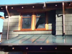 Copper Downspouts & Beam Caps on Greene & Greene Home in Seattle