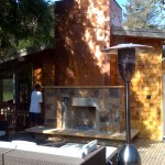 Copper panel fireplace siding